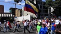 A Venezuelan holds flag as oppositions march during a protest against Maduro government in support to Juan Guaido in Caracas