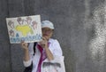 A Venezuelan invites to rebuild as oppositions march during a protest against Maduro government in support to Juan Guaido