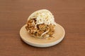 Venezuelan shredded beef arepa with grated fresh cheese on a round resin plate Royalty Free Stock Photo