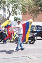 A Venezuelan street vendor selling flags