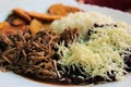 Venezuelan typical dish called Pabellon, made up of shredded meat, black beans, rice, fried plantain slices, and salty cheese. Royalty Free Stock Photo