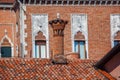 Venice, Ancient brick chimneys above the roofs Royalty Free Stock Photo