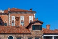 Venice, Ancient brick chimneys above the roofs Royalty Free Stock Photo