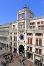 VENICE - APRIL 9, 2017: The view on San Marco Square with tourists near the Zodiac Clock Tower, on April 9, 2017 in Venice, Italy Royalty Free Stock Photo