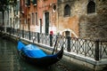 Venice architecture with gondola at the pier