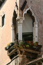 Venice, balcony on the corner with marble Moorish arches Royalty Free Stock Photo