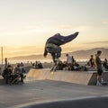 A rider in action at the iconic Venice skatepark at sunset Royalty Free Stock Photo