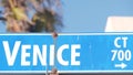 Venice beach street road sign, California city, USA. Tourist resort, palm trees Royalty Free Stock Photo