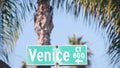 Venice beach street road sign, California city, USA. Tourist resort, palm trees Royalty Free Stock Photo