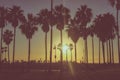 Venice beach Sunset in Los Angeles with a pedestrian walk during orange sunset. Empty beach Royalty Free Stock Photo
