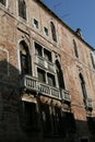 Venice, brick building facade, with Moorish windows and white marble balconies