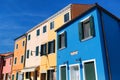 Venice, Burano island canal, small colored houses and the boats