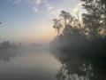 venice canal with fog and reflection at sunrise Royalty Free Stock Photo