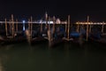 Venice canal with gondolas at night. Royalty Free Stock Photo