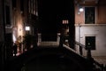 Venice canal with gondolas at night. Italy. Royalty Free Stock Photo