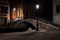 Venice canal with gondolas at night. Italy. Royalty Free Stock Photo