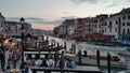 venice canal rialto bridge view people boats sunset