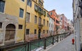 Venice Canal View with Stone Walkway and Distant Bridge