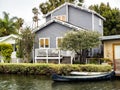 Venice Canals, cosy colorful house with boat on the 13th August, 2017 - Venice Beach, Los Angeles, California