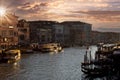 Venice Canals and gondolas near Rialto Bridge and Saint Marco square at sunset