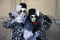 Venice Carnival Figures in black and white costumes and Venetian masks Venice Italy Royalty Free Stock Photo