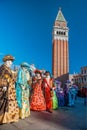 Venice with carnival masks against Mark`s Square in Italy Royalty Free Stock Photo