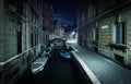 Venice city at night, Italy. Narrow canal with boats and vintage houses at dusk Royalty Free Stock Photo