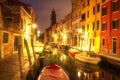 Venice cityscape at night. Italian Venice in the evening. Venetian canal with boats at night. Beautiful view on down town of Royalty Free Stock Photo