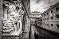 Venice cityscape with old sculpture in black and white, Italy