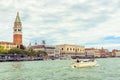 Venice cityscape in summer, Italy. San Marco embankment with Campanile and Doge`s Palace