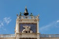 Venice, Clock and bell tower in Renaissance style in San Marco square with the statues called Mori di Venezia, UNESCO world