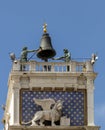 Venice, Clock and bell tower in Renaissance style in San Marco square with the statues called Mori di Venezia, UNESCO world