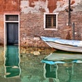 Venice colorful corners with old buildings, window, door and architecture, boats and beautiful water reflections on small canal, Royalty Free Stock Photo