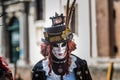 Venice - February 6, 2016: Colourful carnival mask through the streets of Venice