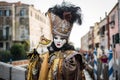 Venice - February 6, 2016: Colourful carnival mask through the streets of Venice