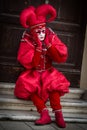 Venice - February 6, 2016: Colourful carnival mask through the streets of Venice