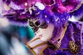 VENICE, FEBRUARY 10: An unidentified woman in typical colorful dress poses during traditional Venice Carnival
