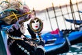 VENICE, FEBRUARY 10: An unidentified woman in typical dress looks into the mirror during traditional Venice Carnival