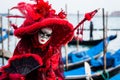 VENICE, FEBRUARY 10: An unidentified woman in typical dress poses during Venice Carnival