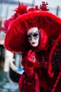 VENICE, FEBRUARY 10: An unidentified woman in typical dress poses during Venice Carnival
