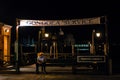 Venice gondola station at night with sitting gondola man Royalty Free Stock Photo
