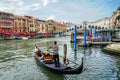 Venice. Gondolas with tourists on the Grand Canal, in the background the Rialto Bridge