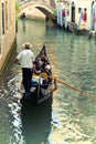 Venice gondolier driving gondola