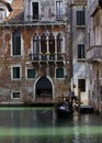 Venice Gondolier floating on a traditional venetian canal