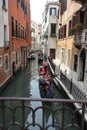 Venice Gondolier floating on a traditional venetian canal