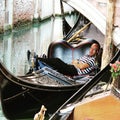 Venice, gondolier resting at lunch time Royalty Free Stock Photo