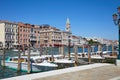 Venice, Grand Canal view with motorboats taxi, Saint Mark bell tower in Italy