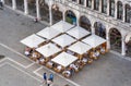 Aerial view with a outdoor restaurant cafe in St Marks Square in Venice
