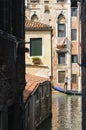 VENICE, ITALY - Ancient buildings and a gondola on the canal in Venice, Veneto,