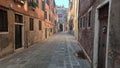 Venice, Italy - April 19, 2021: Old man walk street near cassino in virus pandemie Venice Italy Royalty Free Stock Photo